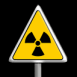 Signe Radioactif dans un panneau danger sur fond noir